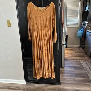 Boutique dress. Elastic around bust. It is long and never worn. No tags
